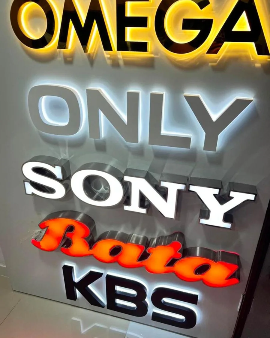 Backlit glow sign letters on a showroom board