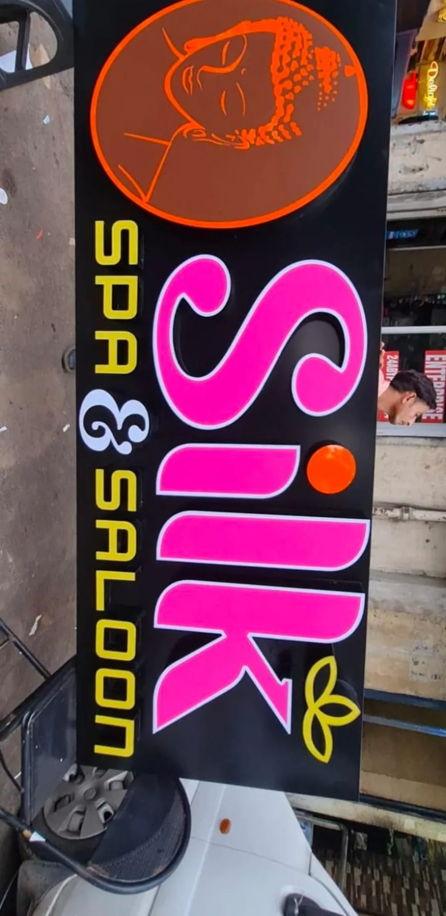 Vertical glow sign board for a spa and salon